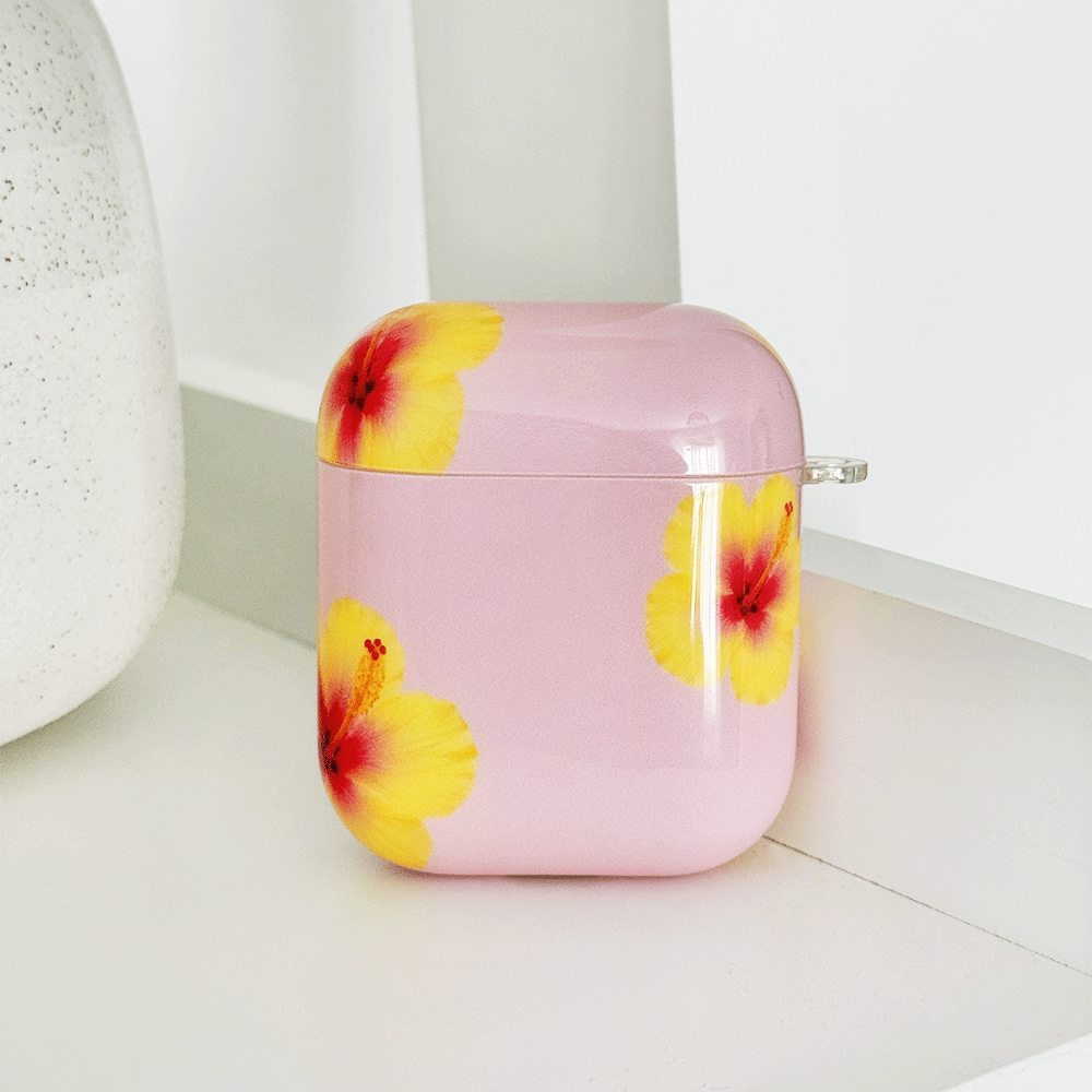 Pink AirPods Case with yellow hibiscus flower design.