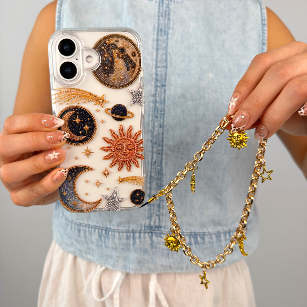 Phone strap attached to phone called celestial phone strap after dark