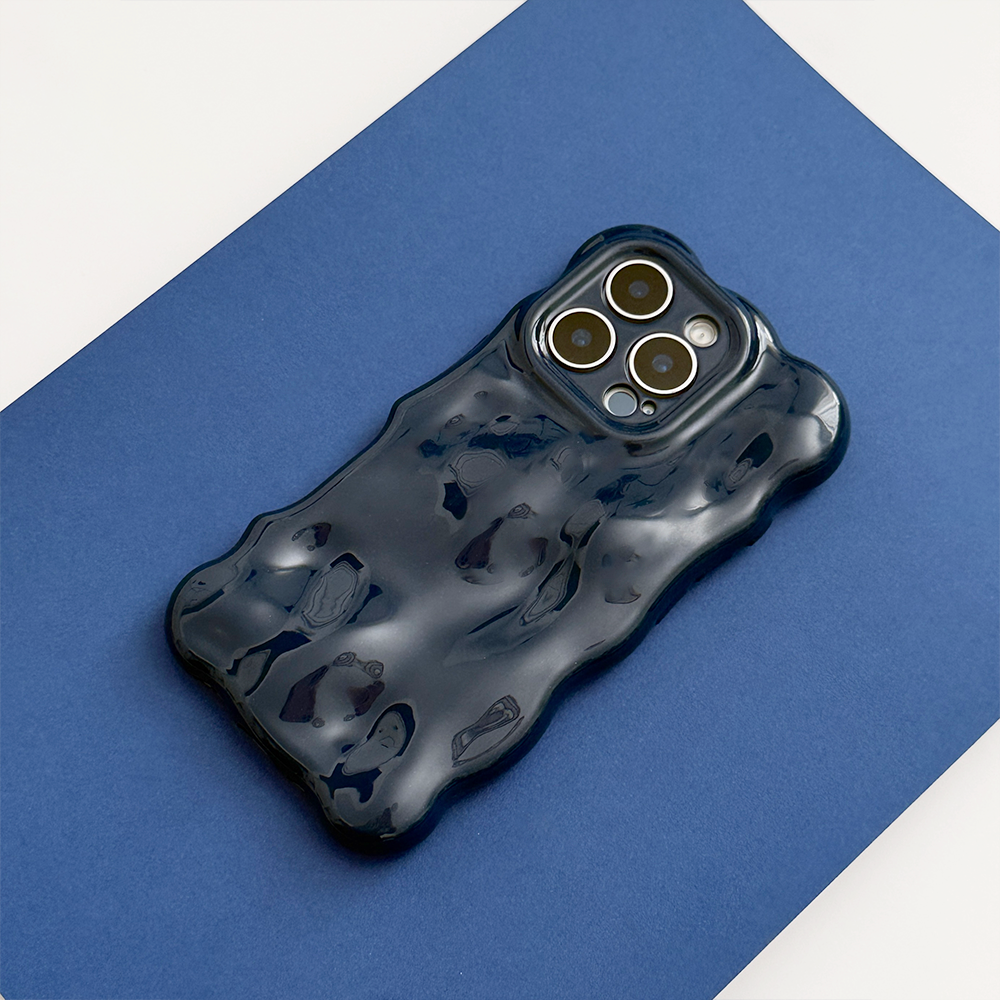 Navy Coconut Lane 3D Bubble phone case with wavy sculpted edges and rippled texture, shown on a blue background.