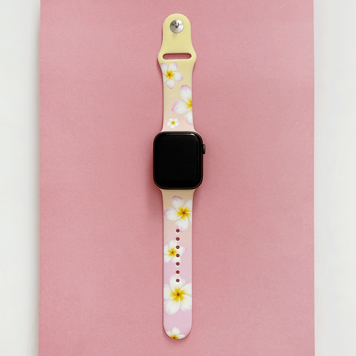 Pink Apple Watch Strap with white flowers.