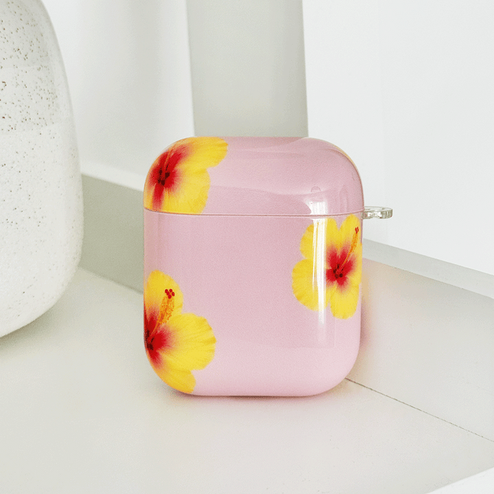 Pink AirPods Case with yellow hibiscus flower design.