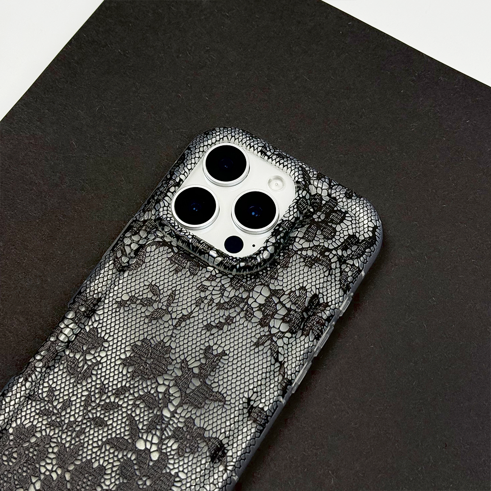 Clear Phone Case with lace design on a dark surface.