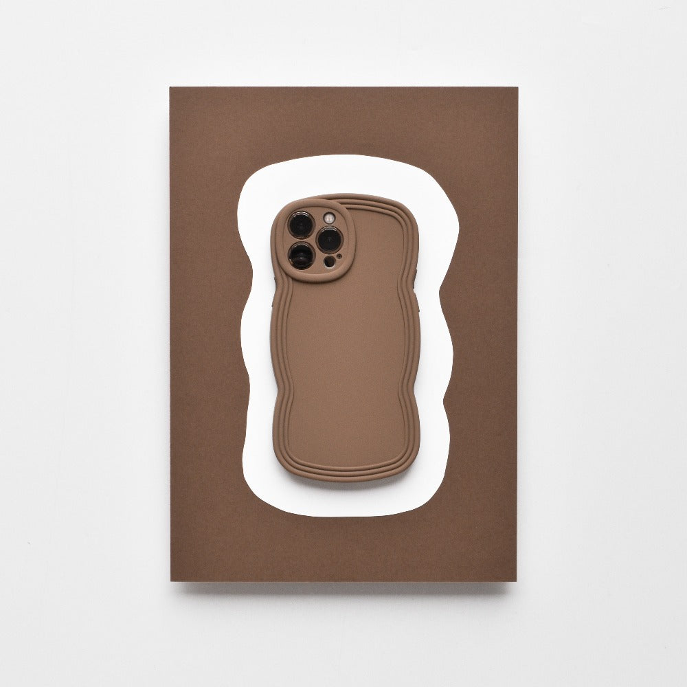 Displayed on a card featuring an abstract white wavy shape on a brown background, the NAKD Curvy Phone Case - Coffee by Coconut Lane is a lightweight and highly protective case with wavy edges. This minimalist design uses neutral tones, making it perfect for those who value both style and functionality in their Curvy Phone Cases.