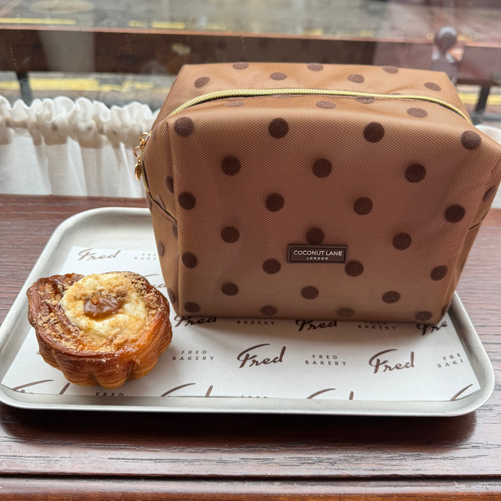 Dot Society chocolate brown makeup bag. Sheer mesh brown material with brown polka dot detailing. 