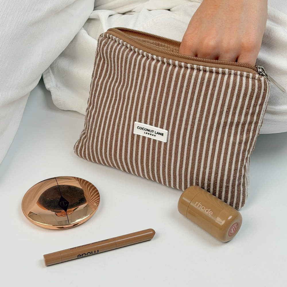 Mini towel everything pouch in chestnut stripes with makeup flatlay