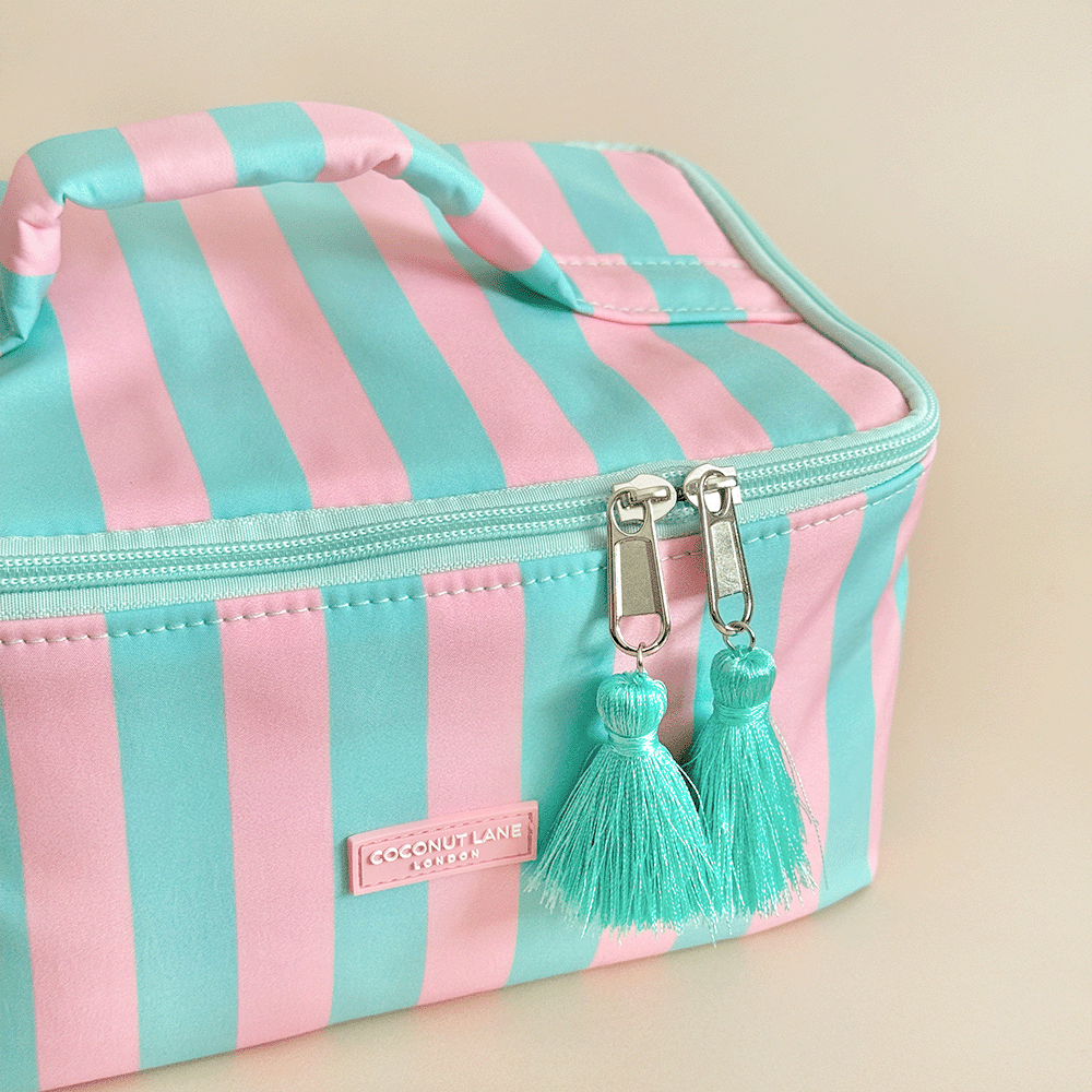 Blue and pink stripe Vanity Case, with tassels and padded handle.