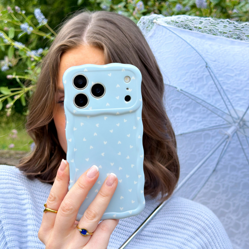 Girl taking selfie with her Wavy Blue Hearts Phone Case