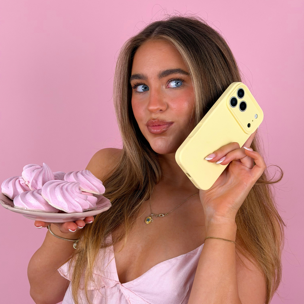 Girl holding butter yellow butter soft phone case with pink biscuits 