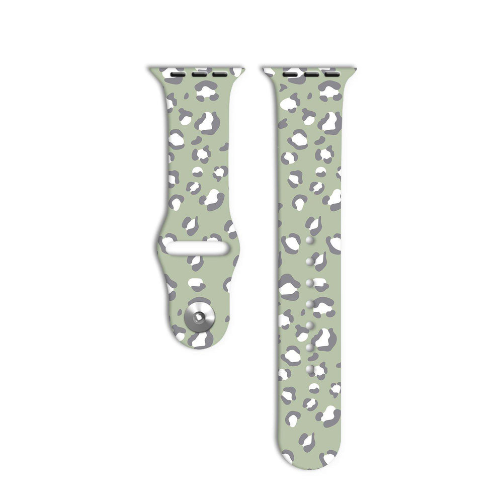 Two pieces of the Sage Leopard Apple Watch Strap by Coconut Lane are displayed against a white background. The strap features a light green base color with a gray and white leopard print pattern, reflecting its unique style from the Sage Leopard Collection.